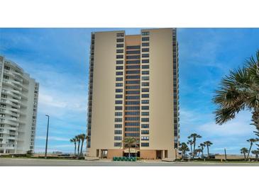 Oceanfront high-rise condo building with palm trees and a blue sky backdrop at 3051 S Atlantic Ave # 2206, Daytona Beach, FL 32118