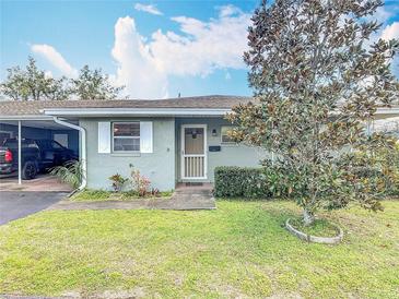 Charming single-story home featuring a well-maintained lawn and mature landscaping at 202 Oakleigh Dr # 90, Deland, FL 32724
