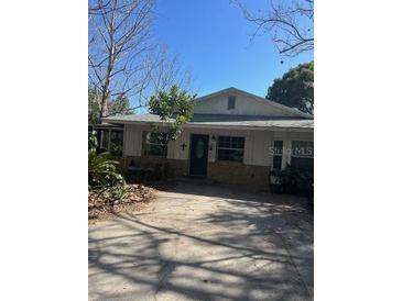 Charming single-story home with a stone accent, mature landscaping, and ample parking space at 485 Dickson Ave, Osteen, FL 32764