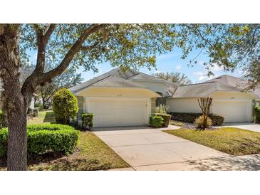 Charming single-story home featuring a two-car garage and well-manicured landscaping at 1422 Carlow Cir, Ormond Beach, FL 32174
