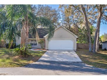 Charming single Gathering home featuring a well-manicured lawn and a two-car garage, located in a tranquil neighborhood at 1430 17Th St, Orange City, FL 32763