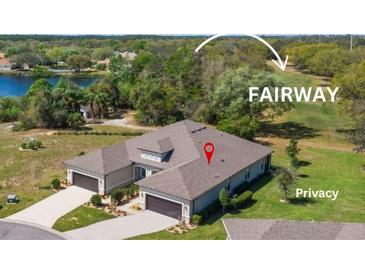 Stunning aerial view of home with a well-manicured lawn, backing onto the lush green fairway of the golf course at 3329 Bailey Ann Dr, Ormond Beach, FL 32174
