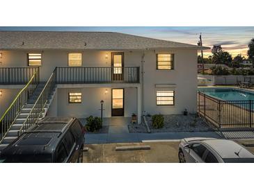 Bright multi-Gathering property featuring a swimming pool and well maintained grounds at sunset at 3620 Cardinal Blvd # 80, Daytona Beach, FL 32118