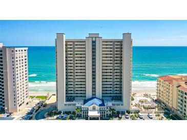 Stunning high-rise beachfront condo building with ocean views and manicured landscaping at 3333 S Atlantic Ave # 2202, Daytona Beach, FL 32118