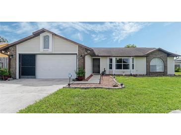 Charming single-Gathering home with two-car garage and manicured lawn at 2625 Sweet Springs St, Deltona, FL 32738