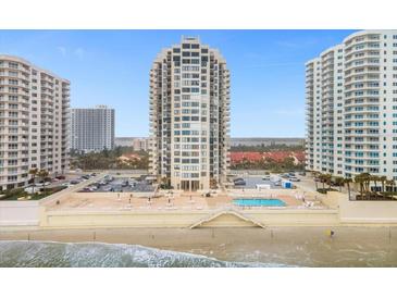 Stunning oceanfront condominium building with private beach access and a beautiful outdoor pool and lounge area at 2947 S Atlantic Ave # 201, Daytona Beach Shores, FL 32118