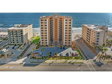 Stunning oceanfront condo building with meticulously maintained landscaping and a convenient parking area at 3799 S Atlantic Ave # 601, Daytona Beach, FL 32118
