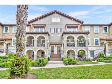 Beautiful multi-Gathering home with arched entryway, lush landscaping, and a red tile roof at 1436 Lobelia Dr, Lake Mary, FL 32746