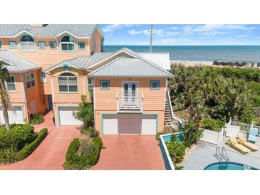 Beachside multi-story home boasting ocean views and a brick driveway at 3000 Ocean Shore Blvd # 6, Ormond Beach, FL 32176