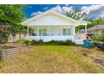 Charming single-story home featuring a welcoming front porch and well-lit exterior at 5261 3Rd St, Orlando, FL 32810