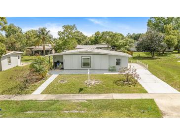 Charming single-story home featuring a well-maintained lawn and a welcoming facade at 1479 Renton St, Deltona, FL 32725