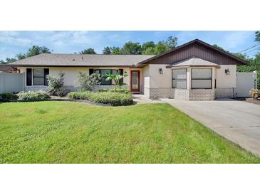 Inviting home featuring a well-maintained lawn and nicely landscaped front yard at 257 Deleon Rd, Debary, FL 32713