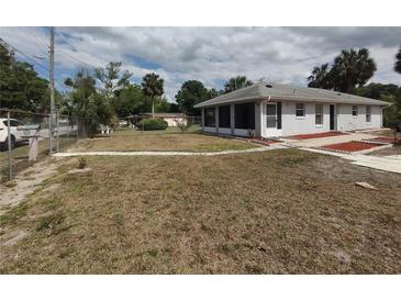 Charming home featuring a well-maintained lawn, inviting walkway, and freshly painted exterior at 540 W Mathis Ave, Deland, FL 32720