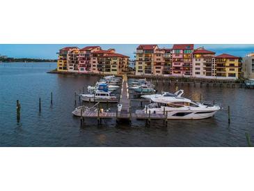 Waterfront condos featuring docks, boats, and beautiful waterfront views at sunset at 761 Marina Point Dr # 7610, Daytona Beach, FL 32114