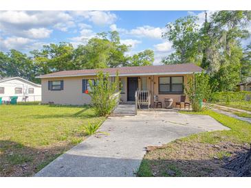 Charming single-story home featuring a classic design with a well-maintained front yard at 816 W Franklin Ave, Deland, FL 32720