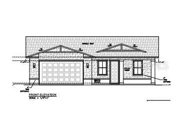 Front elevation of a charming single-story home, with a garage, that showcases simple and attractive architectural design at 2049 West Pkwy, Deland, FL 32724