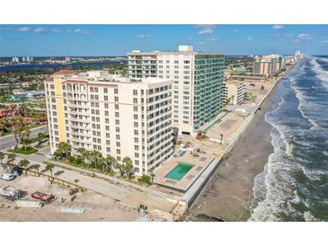 Beautiful aerial view of oceanfront condo featuring pool and gorgeous beach access at 2071 S Atlantic Ave # 705, Daytona Beach, FL 32118
