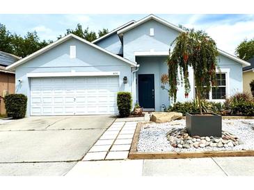 Charming single-story home with a well-manicured front yard and a two-car garage at 4339 Northern Dancer Way, Orlando, FL 32826