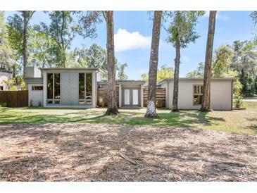 Charming single-story home featuring a modern design and lush landscaping at 510 E Wisconsin Ave, Orange City, FL 32763