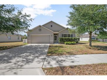 Charming single-story home with a well-maintained lawn and mature landscaping, offering great curb appeal at 811 Grand Park Ct, Deland, FL 32724