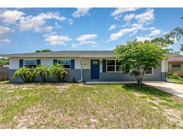 Charming single-story home with blue shutters and a well-maintained front yard, perfect for curb appeal at 1808 Green Pl, Ormond Beach, FL 32174