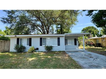 Charming single-story home featuring black shutters, covered entryway, and a well-maintained front yard at 175 Center St, Daytona Beach, FL 32117