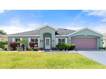 Charming single-story home with well-maintained lawn and landscaping, plus a two-car garage at 979 Leyburn Dr, Deltona, FL 32725
