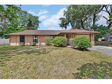 Charming single-story home with well-maintained landscaping in a quiet residential neighborhood at 416 N Blue Lake Ter, Deland, FL 32724