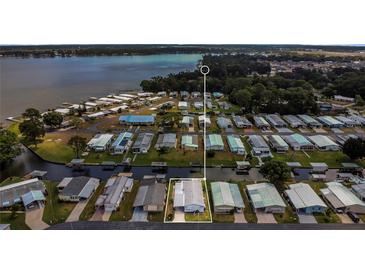 Waterfront community offering a serene lifestyle with access to canals and lake views from the backyard at 119 Jana Cir, Auburndale, FL 33823