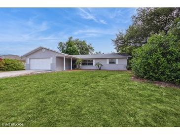 Charming single-story home features a well-manicured lawn and an attached garage in a desirable neighborhood at 810 Sylvia Dr, Deltona, FL 32725
