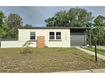 Charming single-story home featuring a modern design and freshly painted exterior at 1408 W Wellington Dr, Deltona, FL 32725