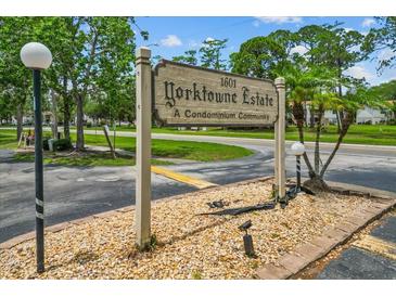 Yorktowne Estates condominium sign featuring the community name and lush green landscaping at 1601 Big Tree Rd # 1302, South Daytona, FL 32119