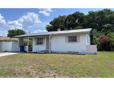 Quaint single-story home with a simple design and front yard, presenting a cozy curb appeal at 2210 Se 1St St, Orange City, FL 32763