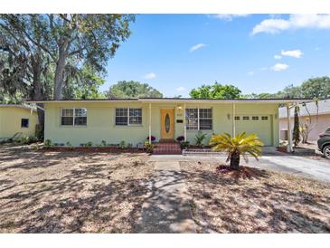 Charming single-story home with a well-maintained lawn, classic architecture, and mature landscaping at 632 Tarragona Way, Daytona Beach, FL 32114