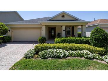 Charming single-story home with a well-manicured front yard and inviting entrance at 1386 Brayford Pt, Deland, FL 32724