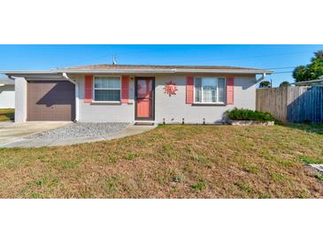 Charming single-story home featuring a well-maintained lawn and inviting front entrance at 26 Ocean Shore Dr, Ormond Beach, FL 32176