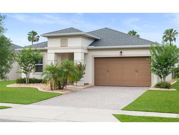 Beautiful single-story home featuring a well-manicured lawn and two-car garage at 5513 Estero Loop, Port Orange, FL 32128