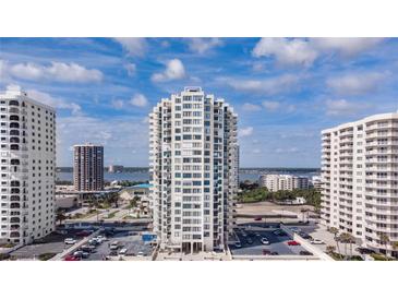 Exterior view of the high-rise condo building on a sunny day, with views of the coastline and surrounding buildings at 2987 S Atlantic # 606, Daytona Beach Shores, FL 32118