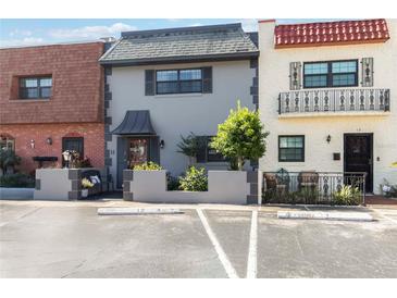 Charming townhome with beautiful landscaping, private entrance and assigned parking at 625 N Halifax Ave # 11, Daytona Beach, FL 32118