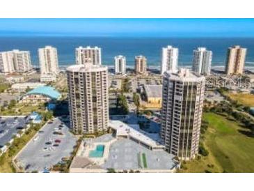 Stunning aerial view of beachfront condo buildings and the sparkling ocean at 1 Oceans West Blvd # 2A1, Daytona Beach, FL 32118
