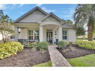 Charming single-story home with well-manicured landscaping, inviting front porch, and a welcoming walkway at 202 W Chancery Ln, Deland, FL 32724