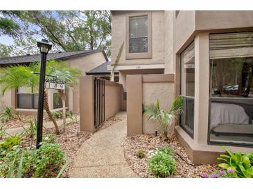 Inviting condo exterior featuring a private entry, natural light, and meticulous landscaping at 940 Douglas Ave # 189, Altamonte Springs, FL 32714