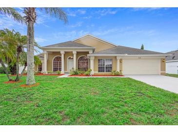 Charming single-story home with a well-manicured lawn, lush landscaping, and a two-car garage at 2263 Catbriar Way, Oviedo, FL 32765