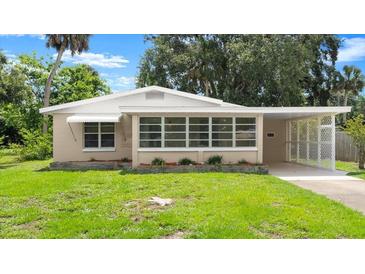 Charming single-story home featuring a well-maintained lawn and neutral exterior color at 2633 Yale Rd, South Daytona, FL 32119