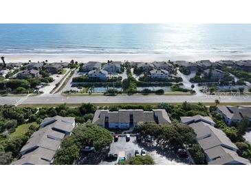 Coastal community featuring residential buildings with access to the beach and tennis courts at 4403 Sea Mist Dr # 2110, New Smyrna Beach, FL 32169