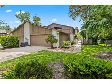 Charming townhome with attached garage, lush landscaping and inviting curb appeal at 8 Rising Moon Trl, Ormond Beach, FL 32174
