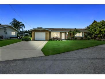 Charming single-story home with a well-manicured lawn and attached one-car garage at 10 Venetian Cir, Port Orange, FL 32127