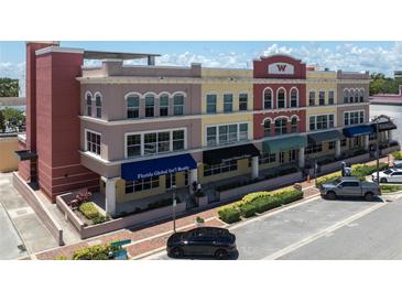 Stylish three-story mixed-use building with varied architectural details and ample street parking at 208 Wall St # 204, Daytona Beach, FL 32114