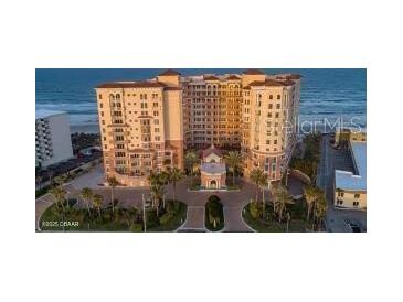 A grand beach-front condo features lush landscaping, and elegant Mediterranean architecture with stunning views at 2515 S Atlantic Ave # 203, Daytona Beach, FL 32118