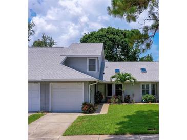 Charming home with a well-maintained lawn and attached garage, providing both curb appeal and convenience at 955 Grayling Ct # B, Port Orange, FL 32127